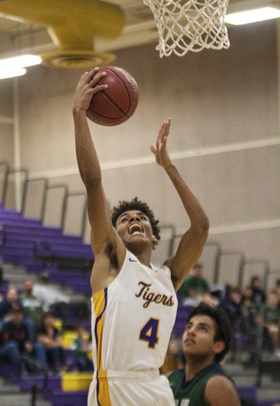 Lemoore High's Daniel Wyatt goes up for two in Wednesday's win over visiting El Diamante. The Tigers improved to 2-0 in league play with the win.